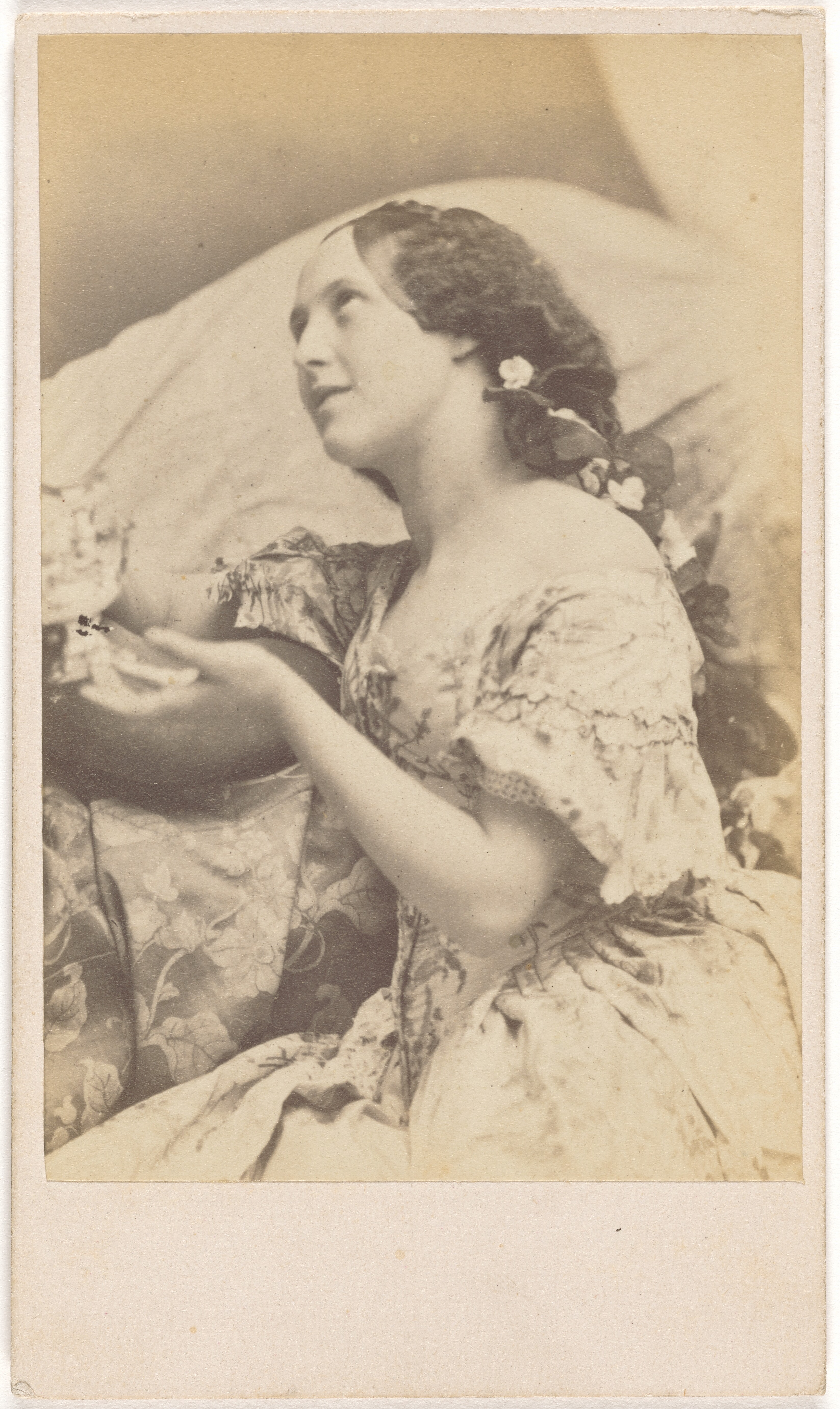 [Seated Young Woman with Flowers in Braided Hair Looking Up to the Ceiling] (84.XM.845.13)
